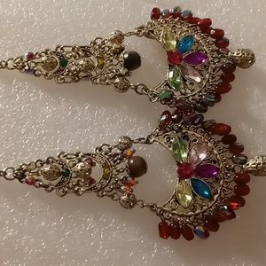 Dangling earrings with Opalescent beading reds, greens beautiful blues.